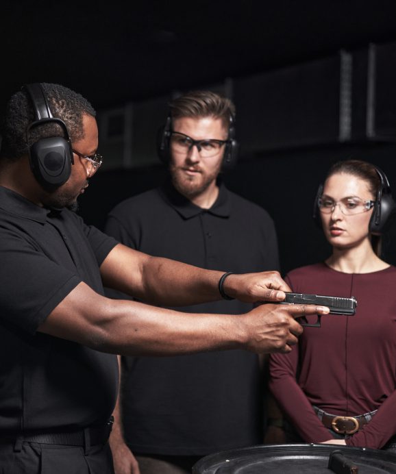 Gun safety training with protective gear.