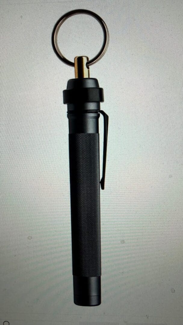 Black tactical pen with key ring attachment.